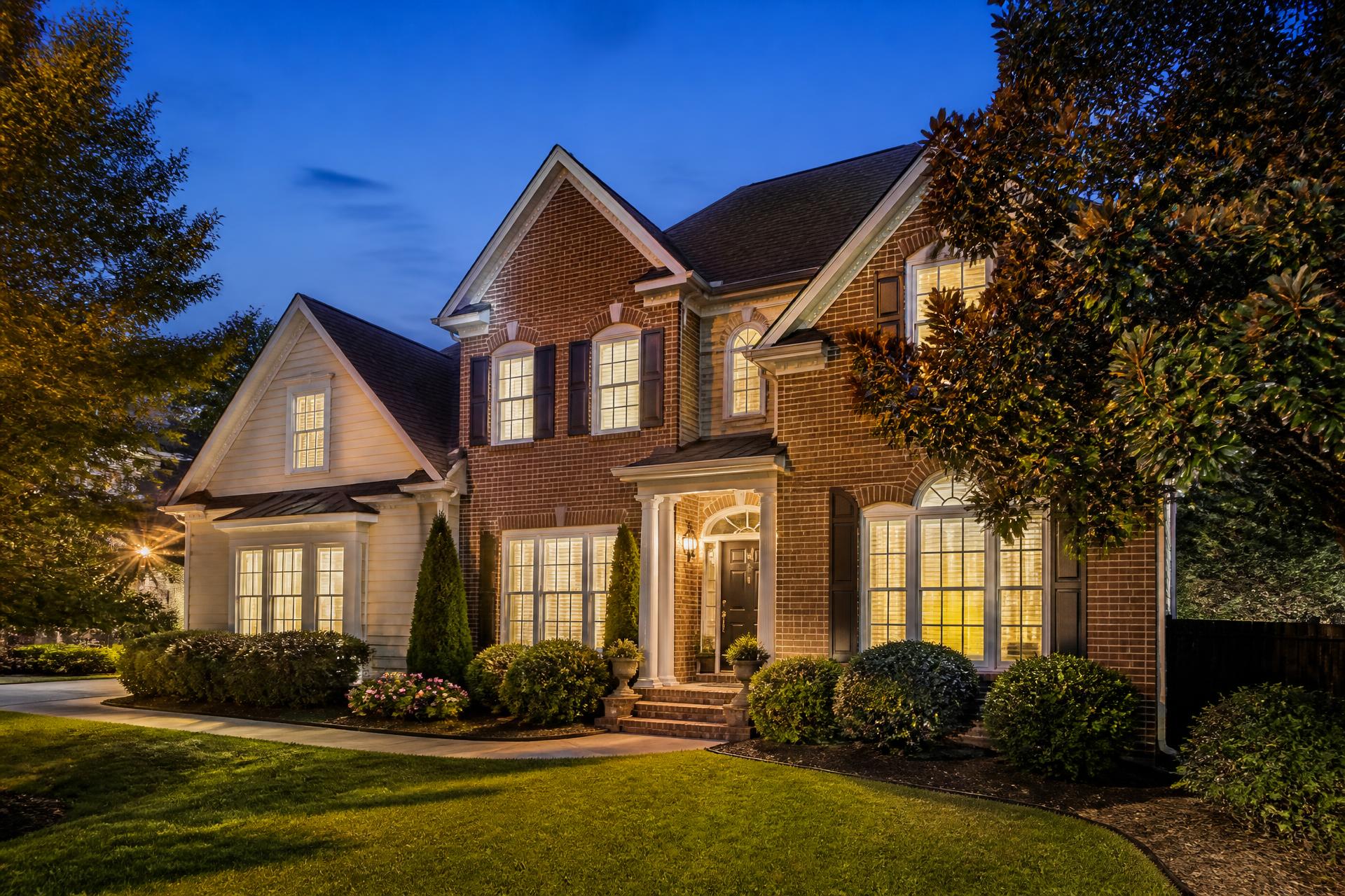 Modern Georgia home lit at dusk